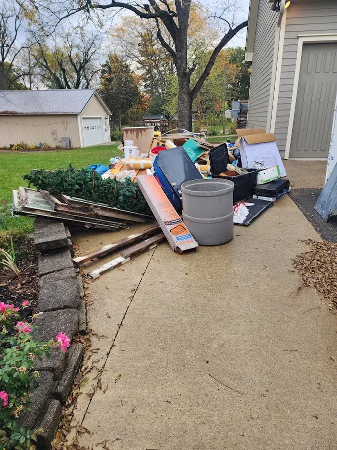 Dumpster being loaded with debris for Demolition Dumpster Rental in Mentor-on-the-Lake